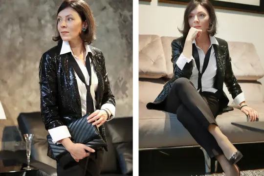 Eleganckie stylizacje sylwestrowe ze spodniami: błyszcząca marynarka, biała koszula i czarne spodnie. Idealne na powitanie Nowego Roku.