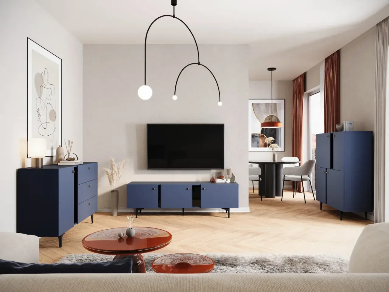 Nowoczesny salon z granatowymi meblami i ekstrawagancką lampą. W tle stół z krzesłami.